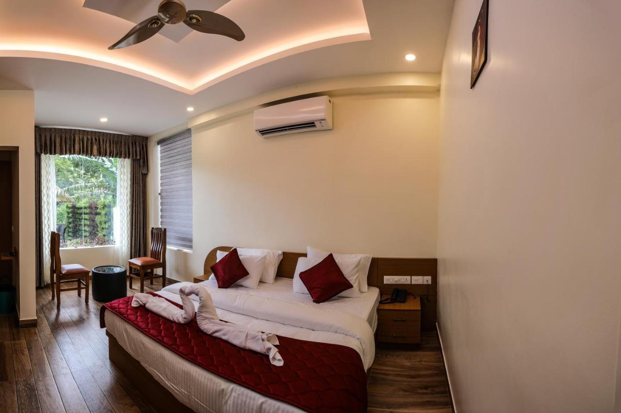 Thenmala Hormuz Inn Kolattupuzha Buitenkant foto